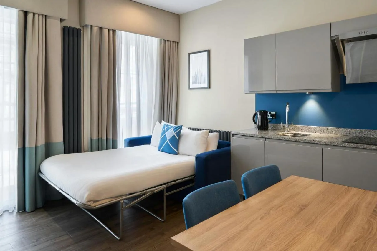 Studio room with bed, dining table and kitchenette at Four Points Flex by Sheraton Edinburgh